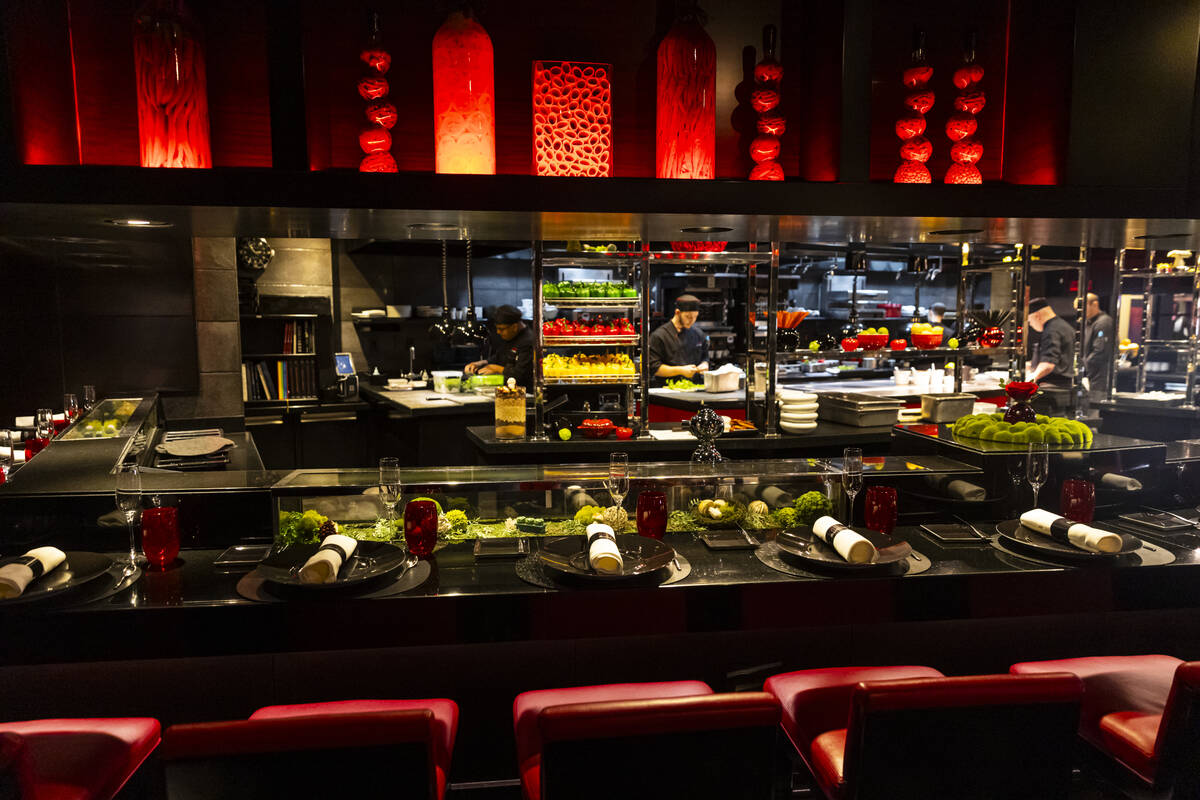 The counter with a view of the open kitchen at L'Atelier de Joël Robuchon at the MGM Grand on ...