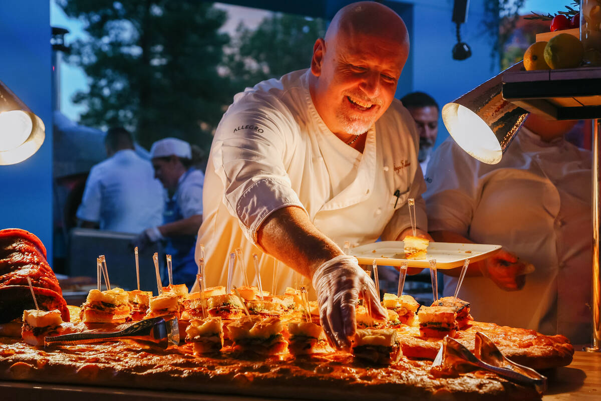 Chef Enzo Febbraro, of Allegro, puts out focaccia scrocchiarella, with homemade porchetta, prov ...