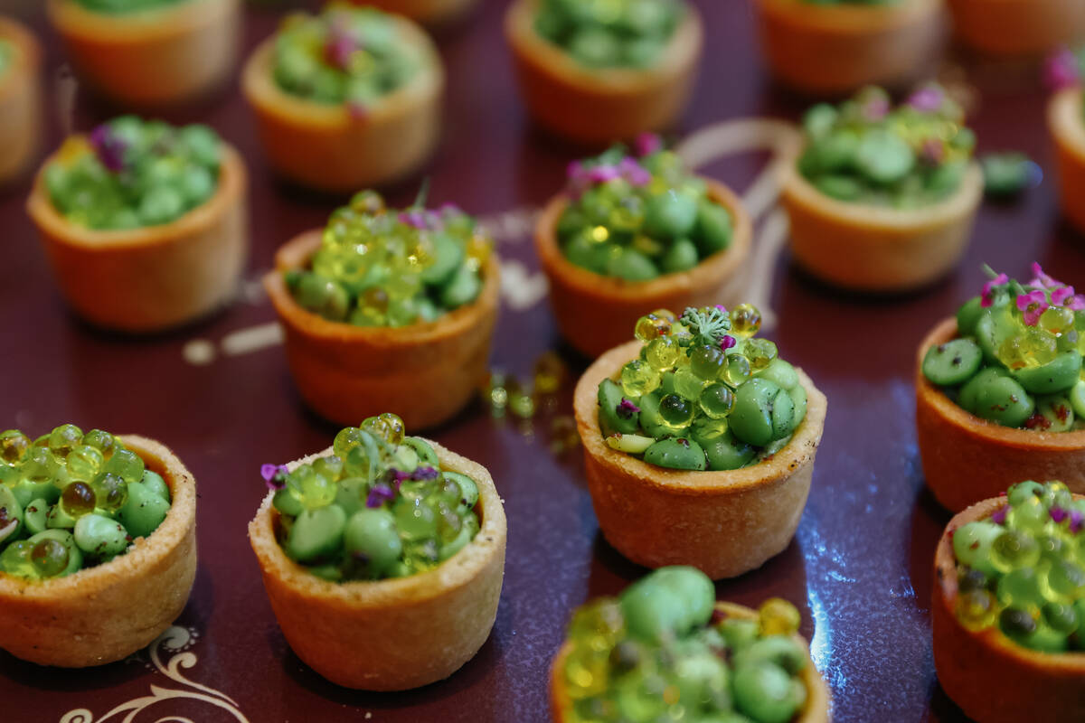 Green pea and truffle hummus tartlets, with edamame hummus, sumac, snow pea, and Manjimup black ...