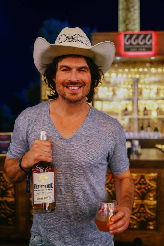 Actor Ian Somerhalder poses for a portrait with a bottle of his bourbon whiskey during Revelry& ...