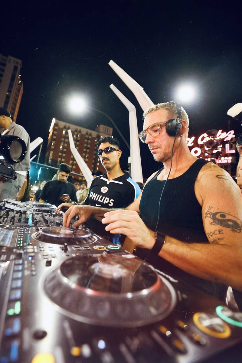 Ape Drums, left, and Diplo of Major Lazer Soundsystem are shown at "Feed The Block" in downtown ...