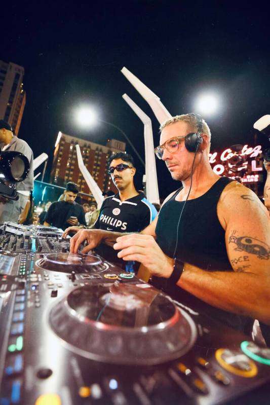 Ape Drums, left, and Diplo of Major Lazer Soundsystem are shown at "Feed The Block" in downtown ...