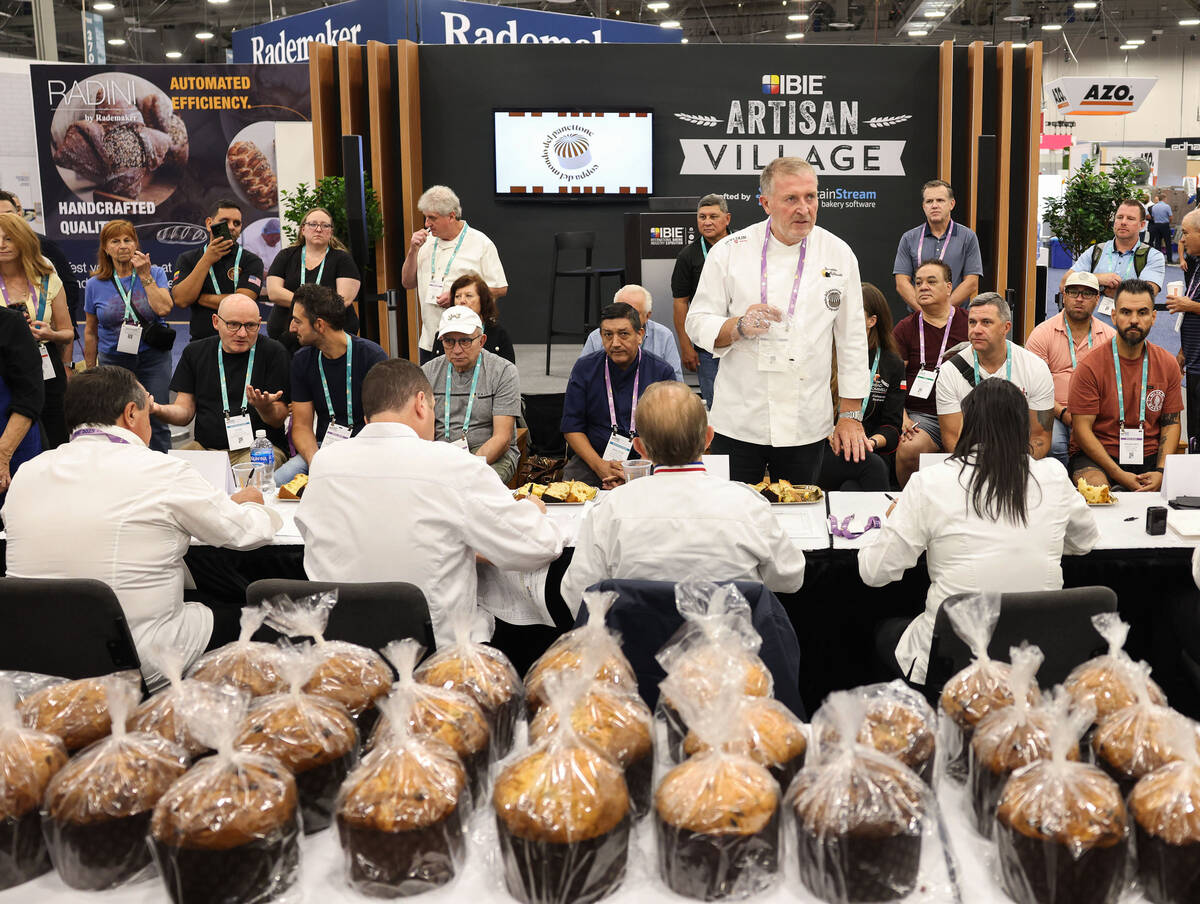 Giuseppe Piffaretti, top/right, explains the rules of the Panettone World Cup at the Internatio ...
