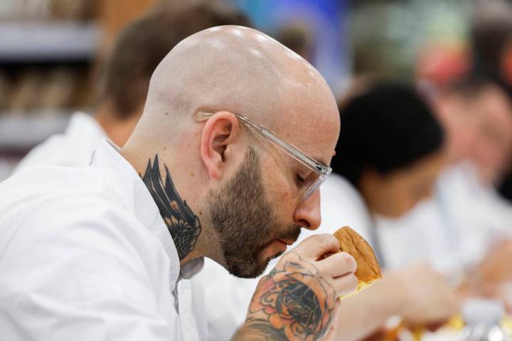 Judge and pastry chef Marco Lusso smells a sample of panettone during the Panettone World Cup a ...