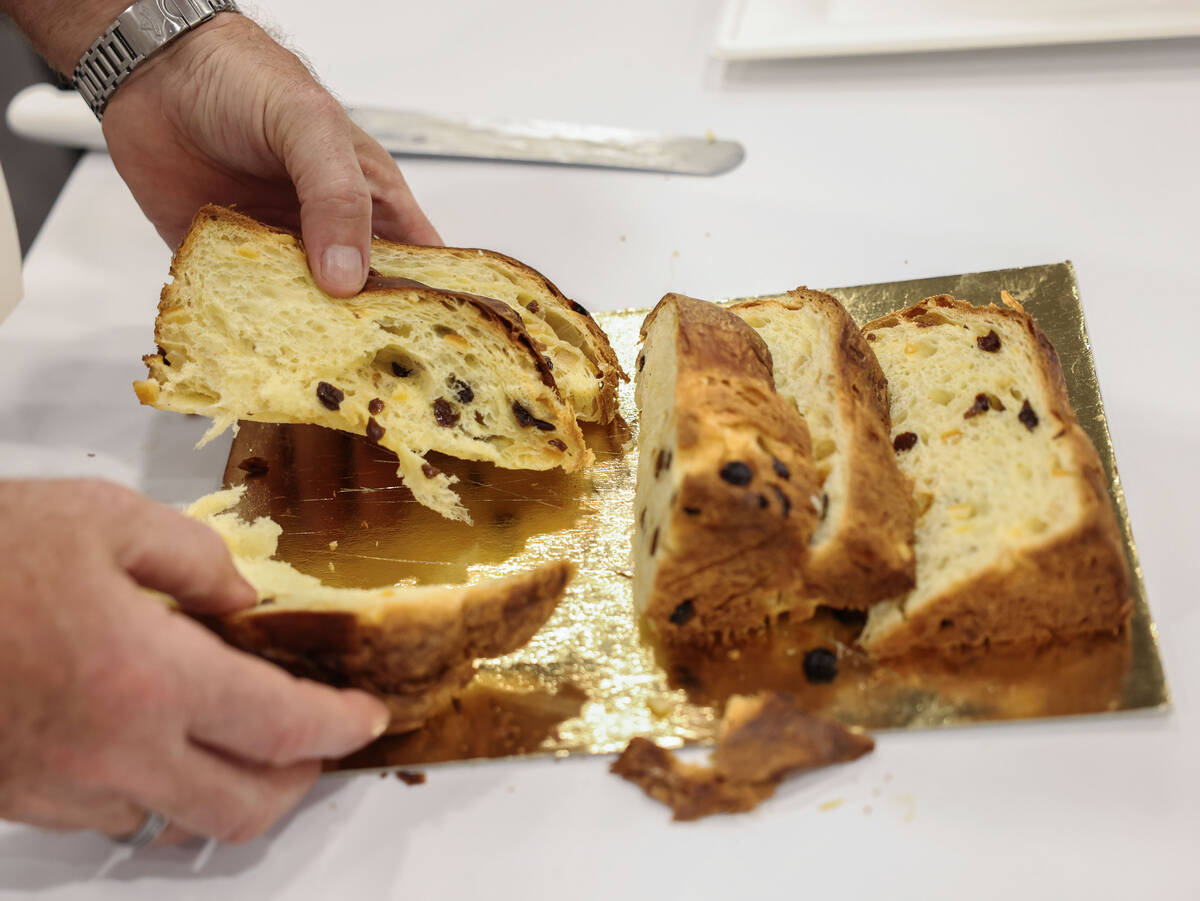 Giuseppe Piffaretti cuts fresh slices of panettone during the Panettone World Cup at the Intern ...