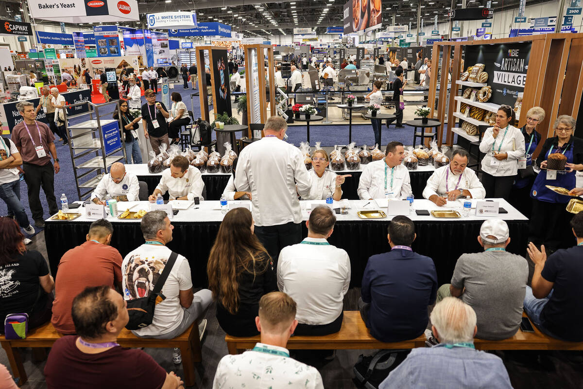 Giuseppe Piffaretti, top/middle, discusses the rules with judges during the Panettone World Cup ...