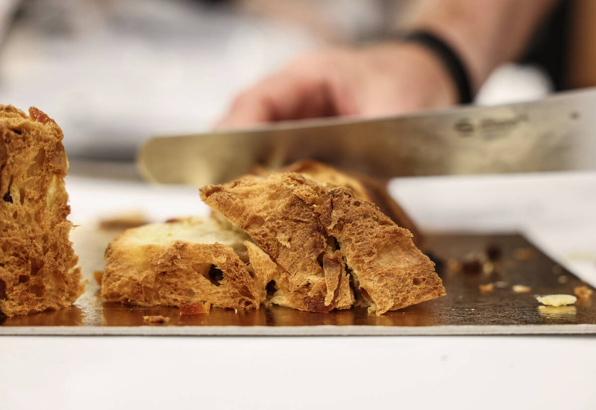 Giuseppe Piffaretti cuts fresh slices of panettone during the Panettone World Cup at the Intern ...