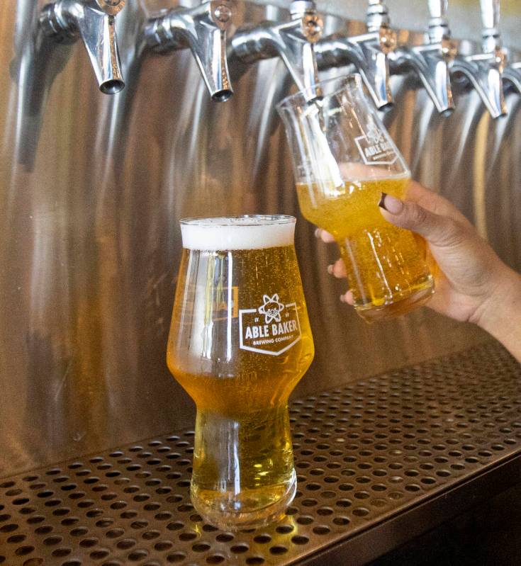 Irish Domingo pours glasses of Atomic Duck at Able Baker Brewery, Monday, Sept. 30, 2024, in La ...