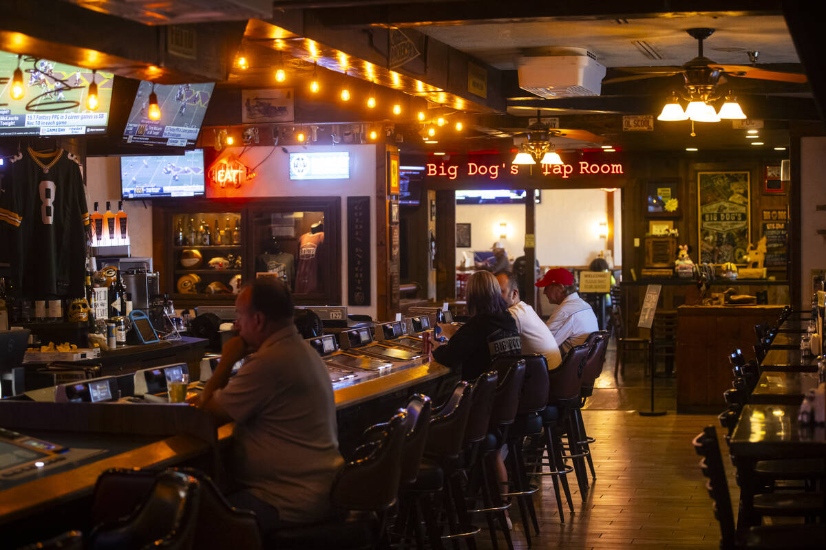 People sit at the bar at Big Dog’s Draft House, at 4543 N. Rancho Drive, on Thursday, Sept. 1 ...