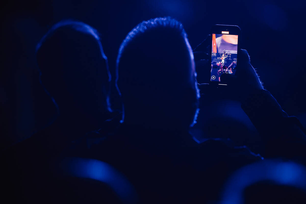 A fan videotapes Sammy Hagar during night one of the iHeartRadio Music Festival at T-Mobile Are ...