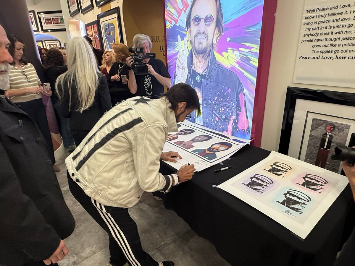 Ringo Starr signs prints of his artwork at "Starr Art" at the Animazing Gallery inside of the T ...