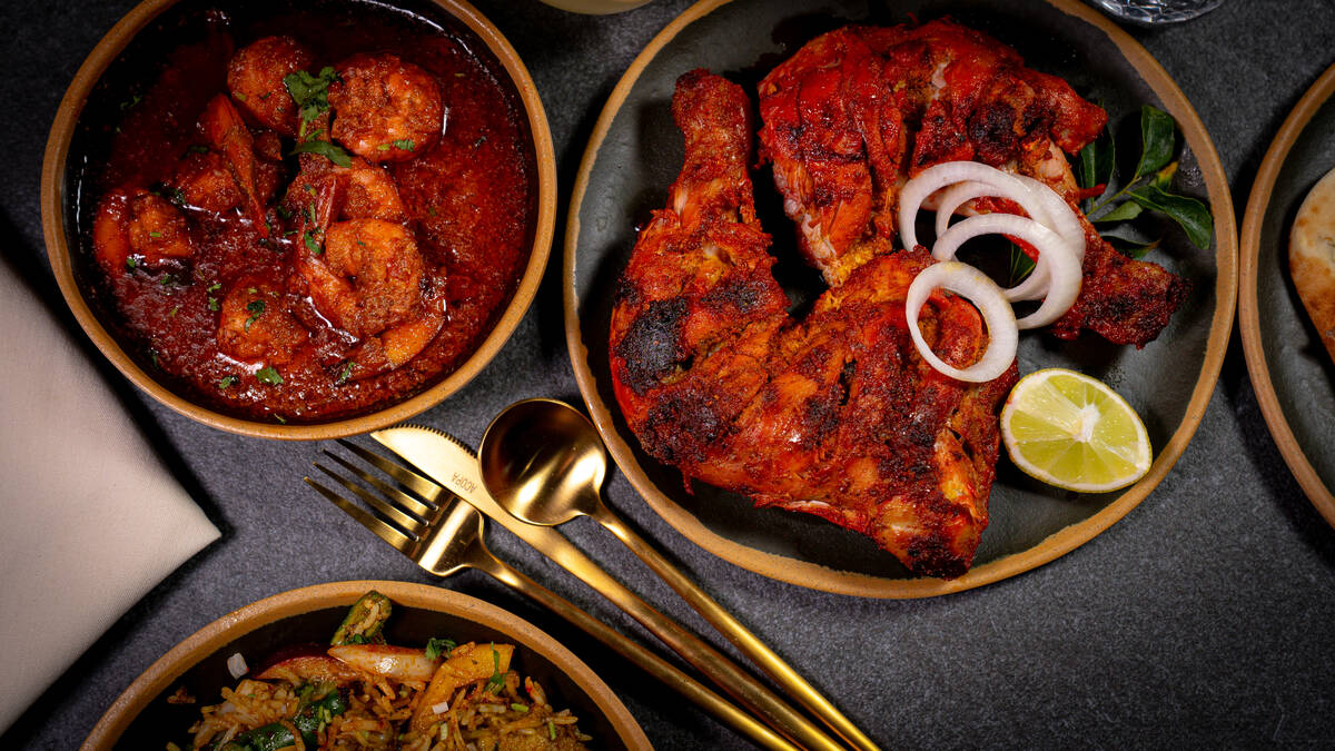 Shrimp curry, left, and tandoor chicken from Taste of Gujarat, an Indian restaurant opening Sep ...