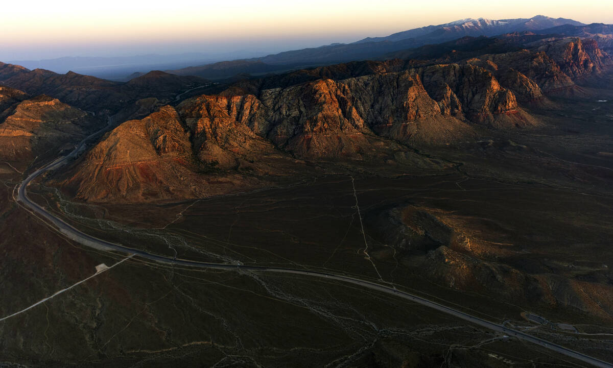The Spring Mountains range catches the early morning light about the Red Rock Canyon National C ...