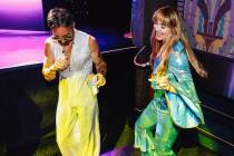 Rich Porter, left, and Caitlen Todd dance during a listening party for Taylor Swift’s ne ...