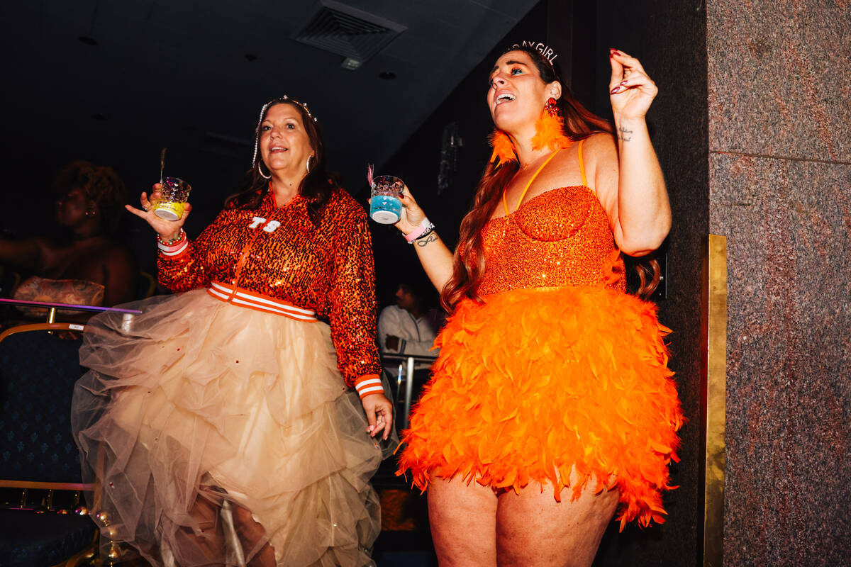 Swifties dance during a listening party for Taylor Swift’s new album “The Life of ...