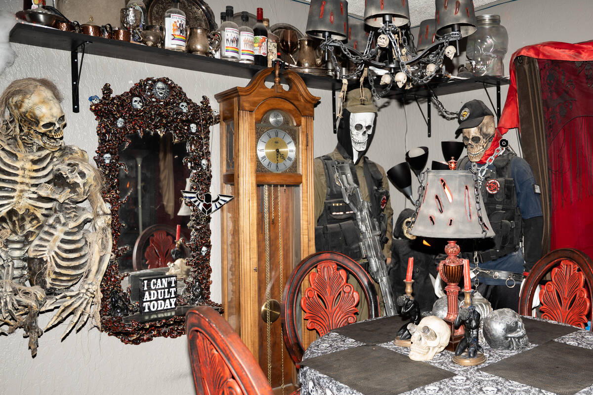 Halloween decorations fill the living room of Skull Manor, year-round Halloween-themed home in ...