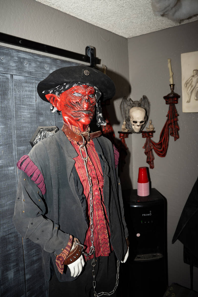 Halloween decorations fill the living room of Skull Manor, year-round Halloween-themed home in ...