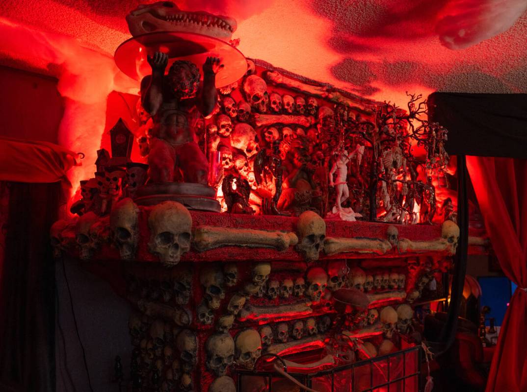 Halloween decorations fill the living room of Skull Manor, year-round Halloween-themed home in ...
