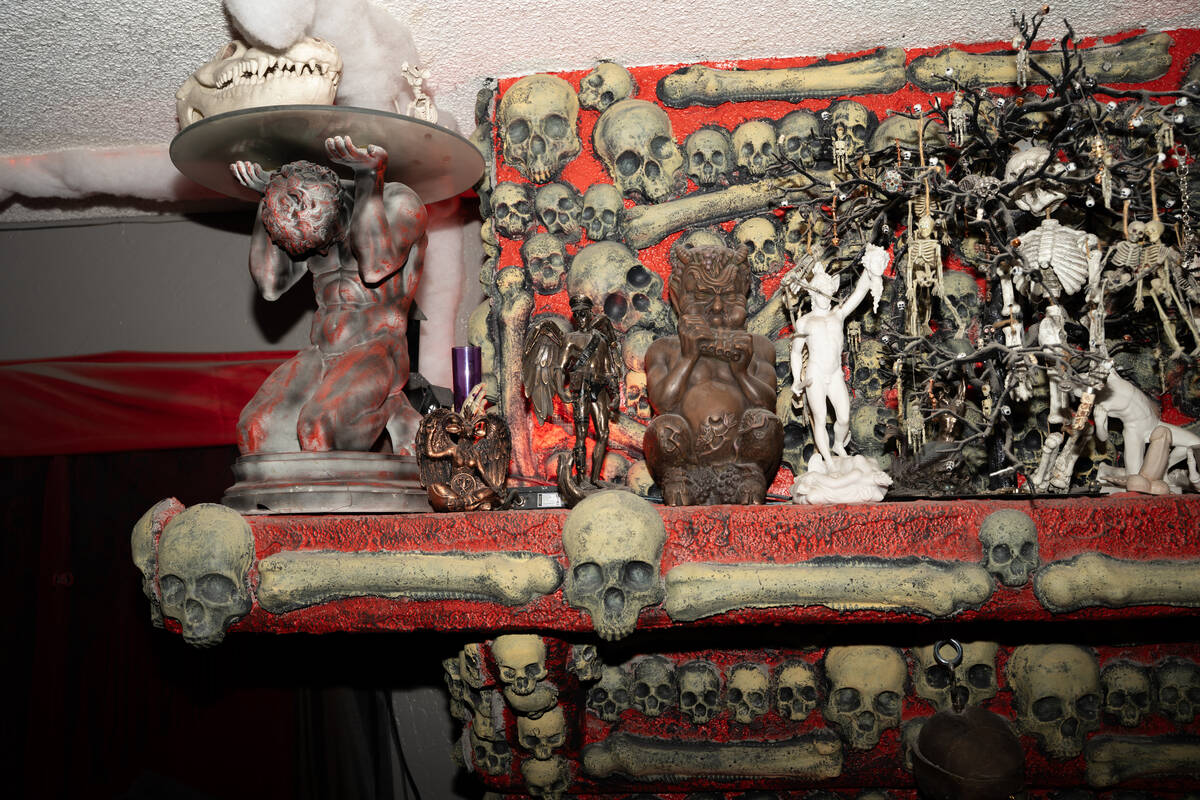 Halloween decorations fill the living room of Skull Manor, year-round Halloween-themed home in ...
