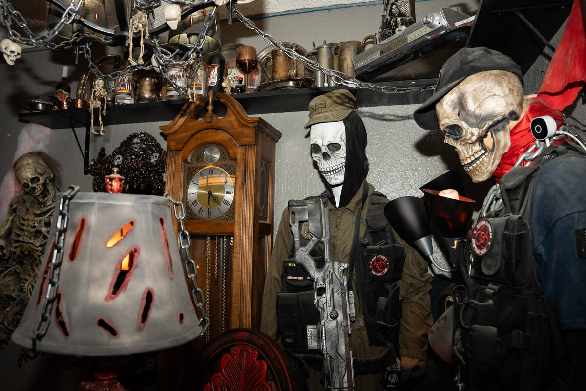 Halloween decorations fill the living room of Skull Manor, year-round Halloween-themed home in ...