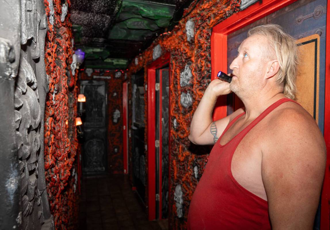 David “Fido” Parry shines a black light on the hallways of his home called Skull ...