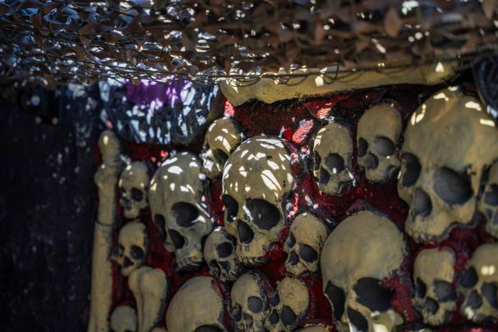 A wall with skulls is seen in the front yard of Skull Manor, a year-round Halloween-themed hous ...