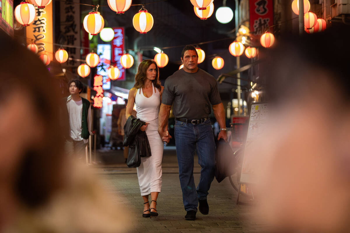 Emily Blunt, left, and Dwayne Johnson in “The Smashing Machine.” (A24/TNS)