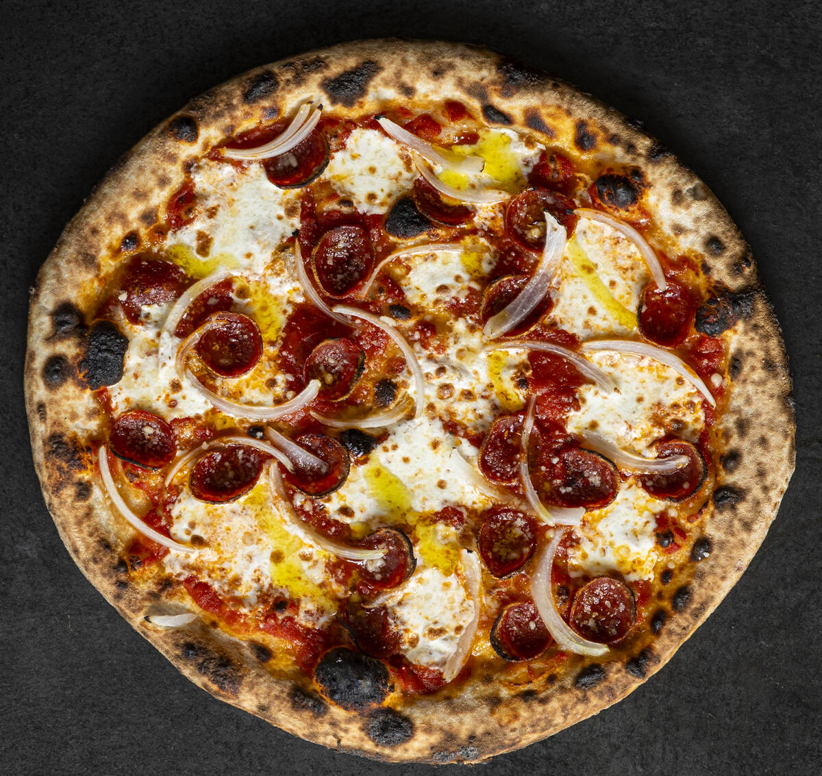 A Classic Pepperoni and Onion Pizza from How Ya Dough'n, a viral pizzeria set to open in Novemb ...