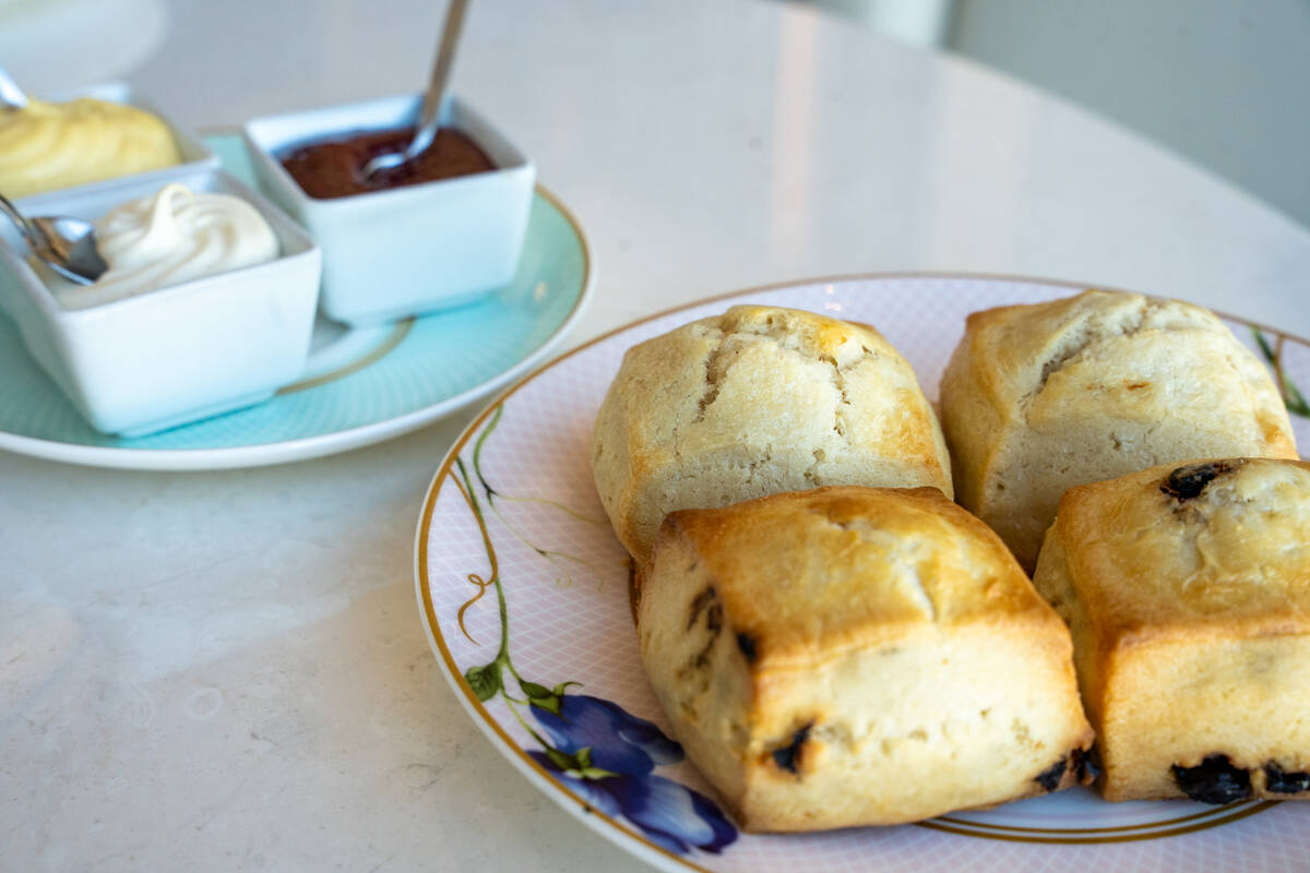 Warm plain and blueberry scones are served during Peacock Alley’s Pink Ribbon Tea, an af ...