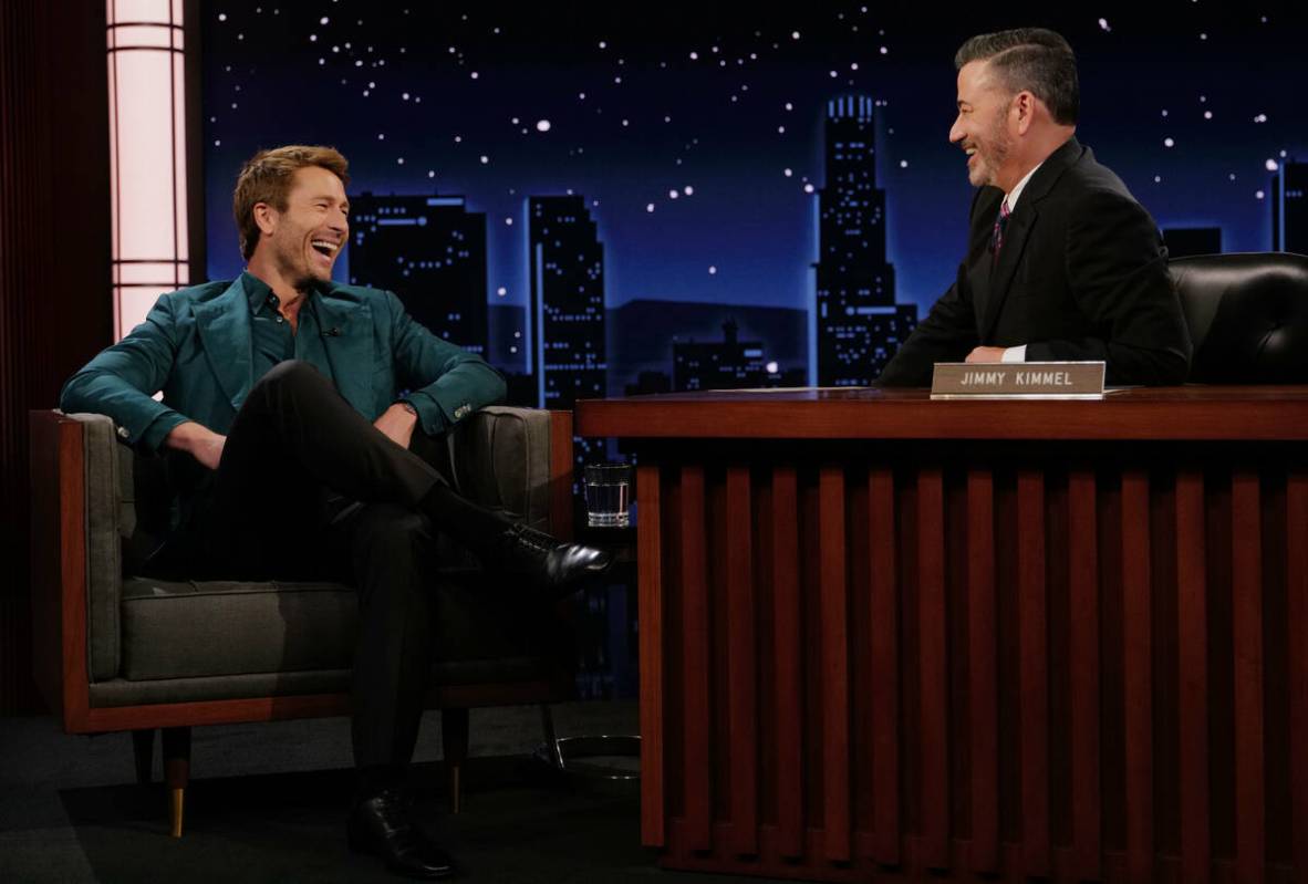 This image released by Disney shows guest Glen Powell, left, and host Jimmy Kimmel on "Jim ...