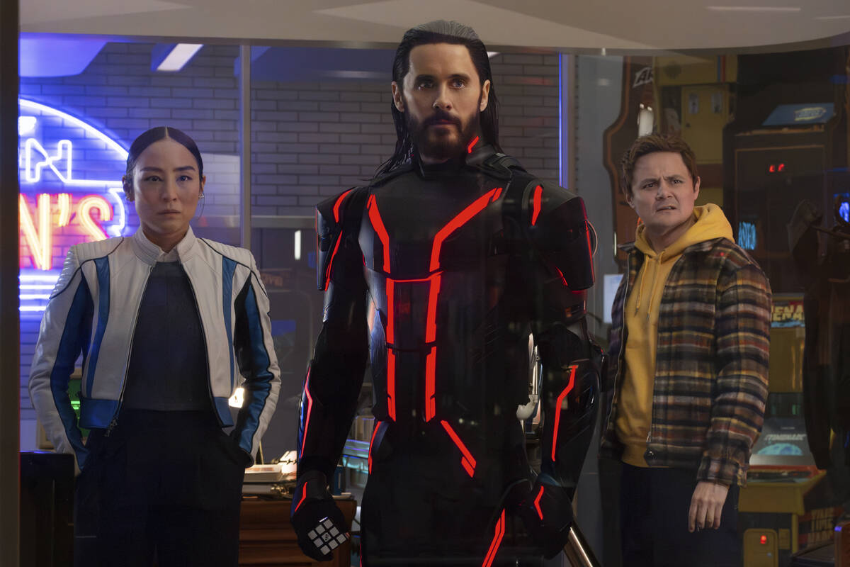 This image released by Disney shows Greta Lee, from left, Jared Leto and Arturo Castro in a sce ...