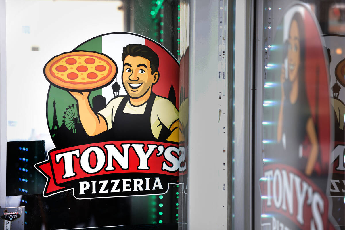 Caricatures of Tony’s Pizzeria owners Tony Cimino and Ashleigh Hughes are seen on the exterio ...