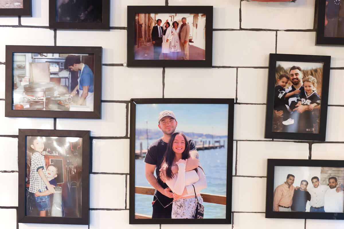 Photos of Tony’s Pizzeria owners Ashleigh Hughes and Tony Cimino’s family are seen on the w ...