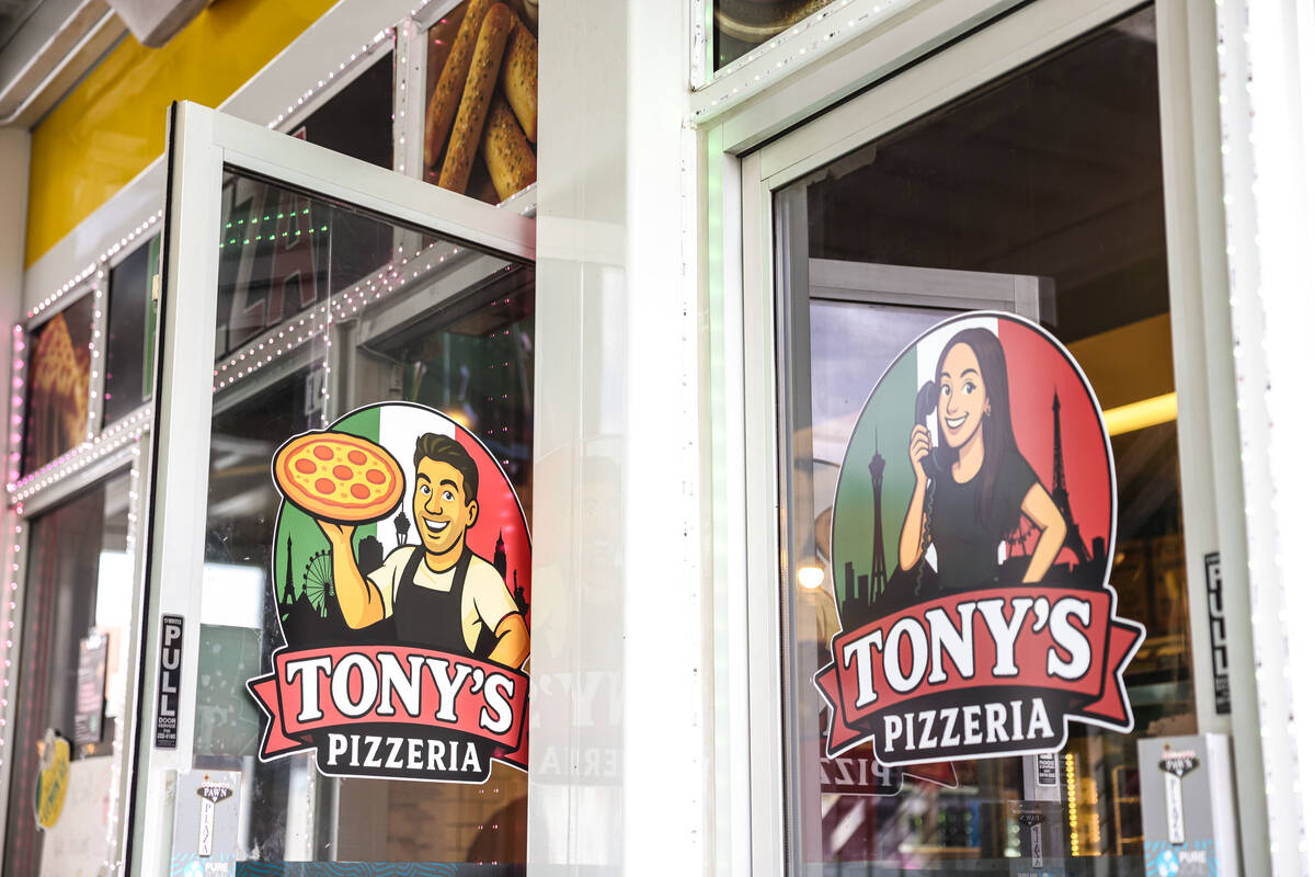 Caricatures of Tony’s Pizzeria owners Tony Cimino and Ashleigh Hughes are seen on the exterio ...