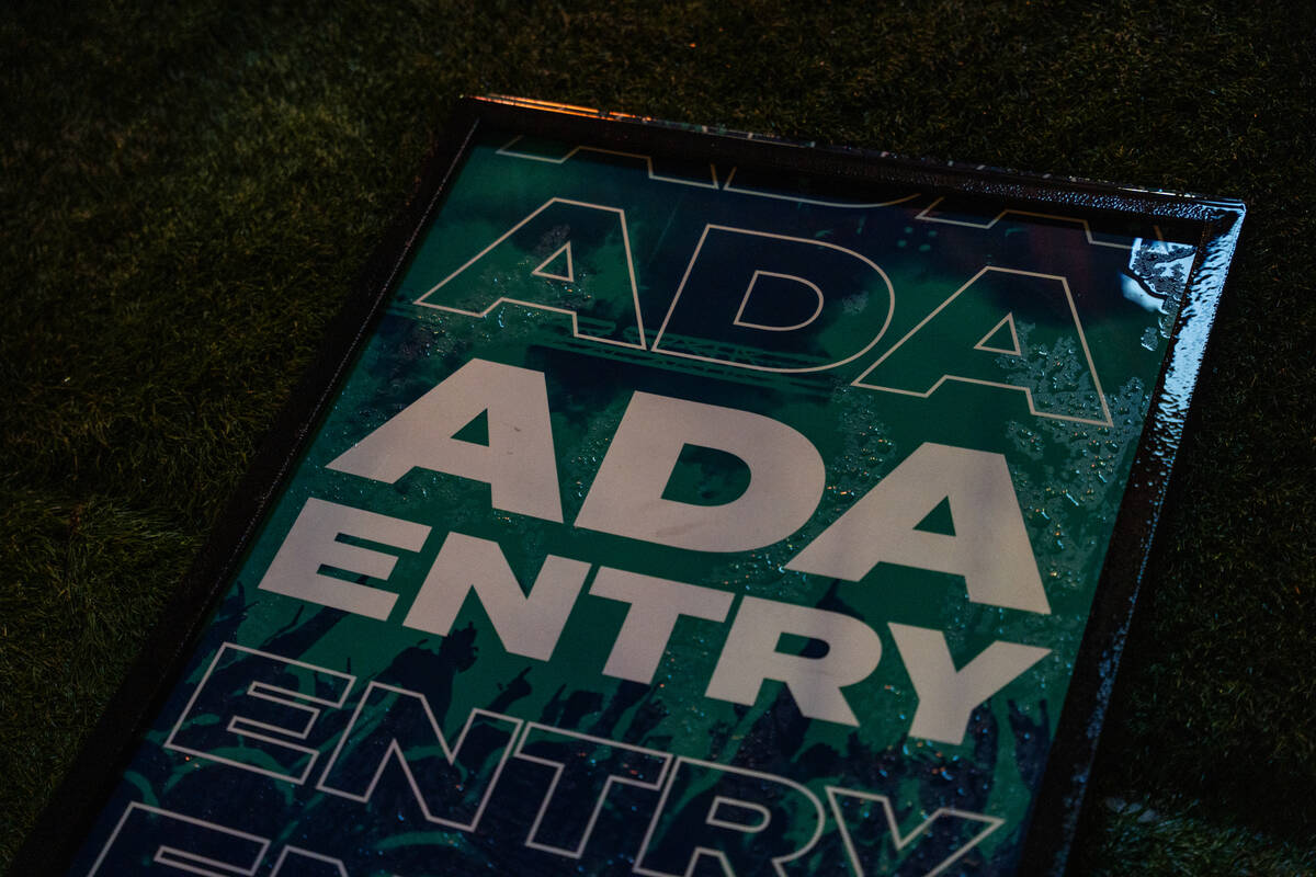 A wet sign lies on the ground during a 90-minute rain delay at Best Friends Forever Fest at the ...