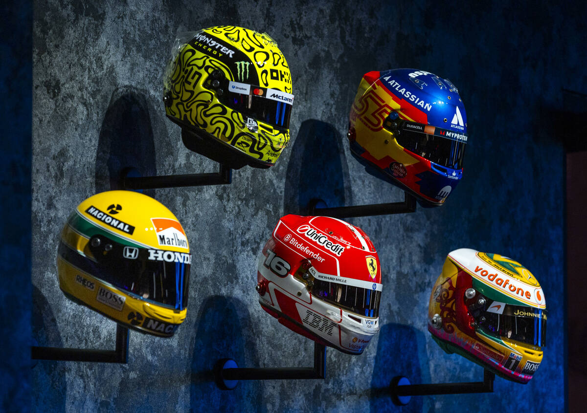 A collection of racing helmets are hanging on the walls as the F1 Las Vegas Arcade will open ne ...
