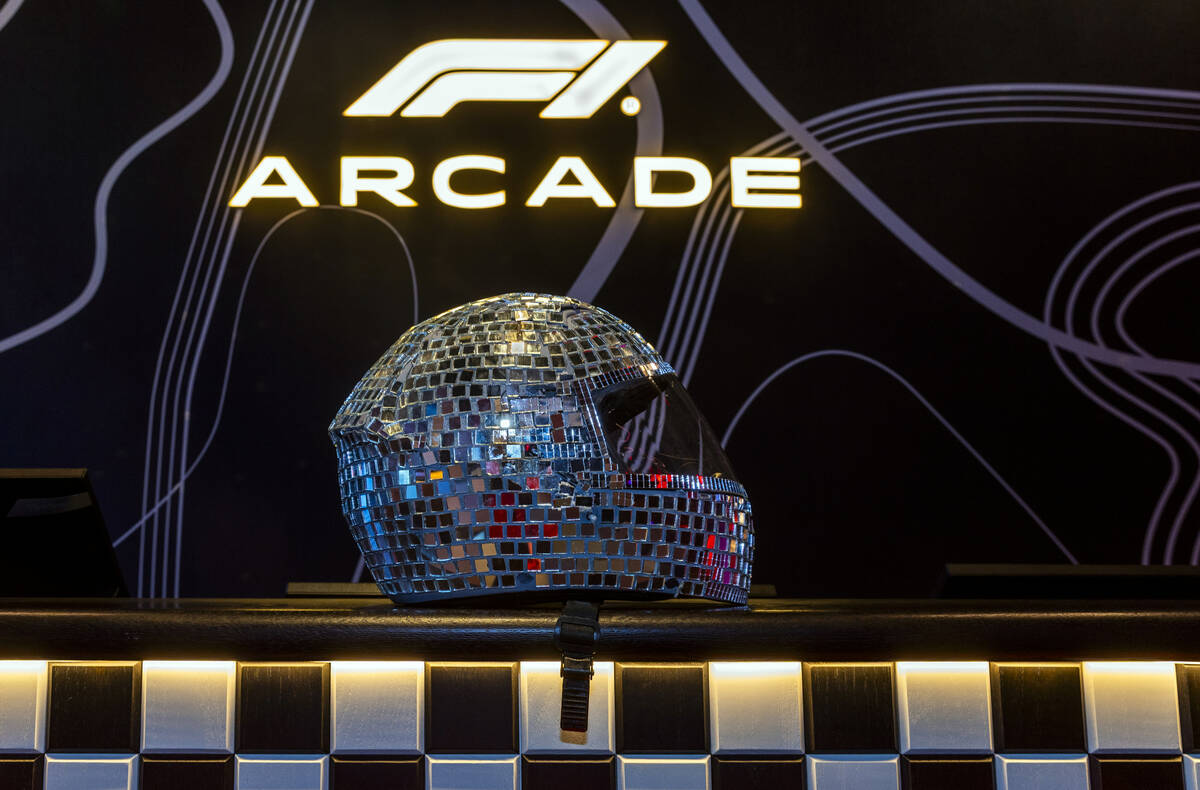 A mirrored helmet is on display as the F1 Las Vegas Arcade will open next week within the Forum ...