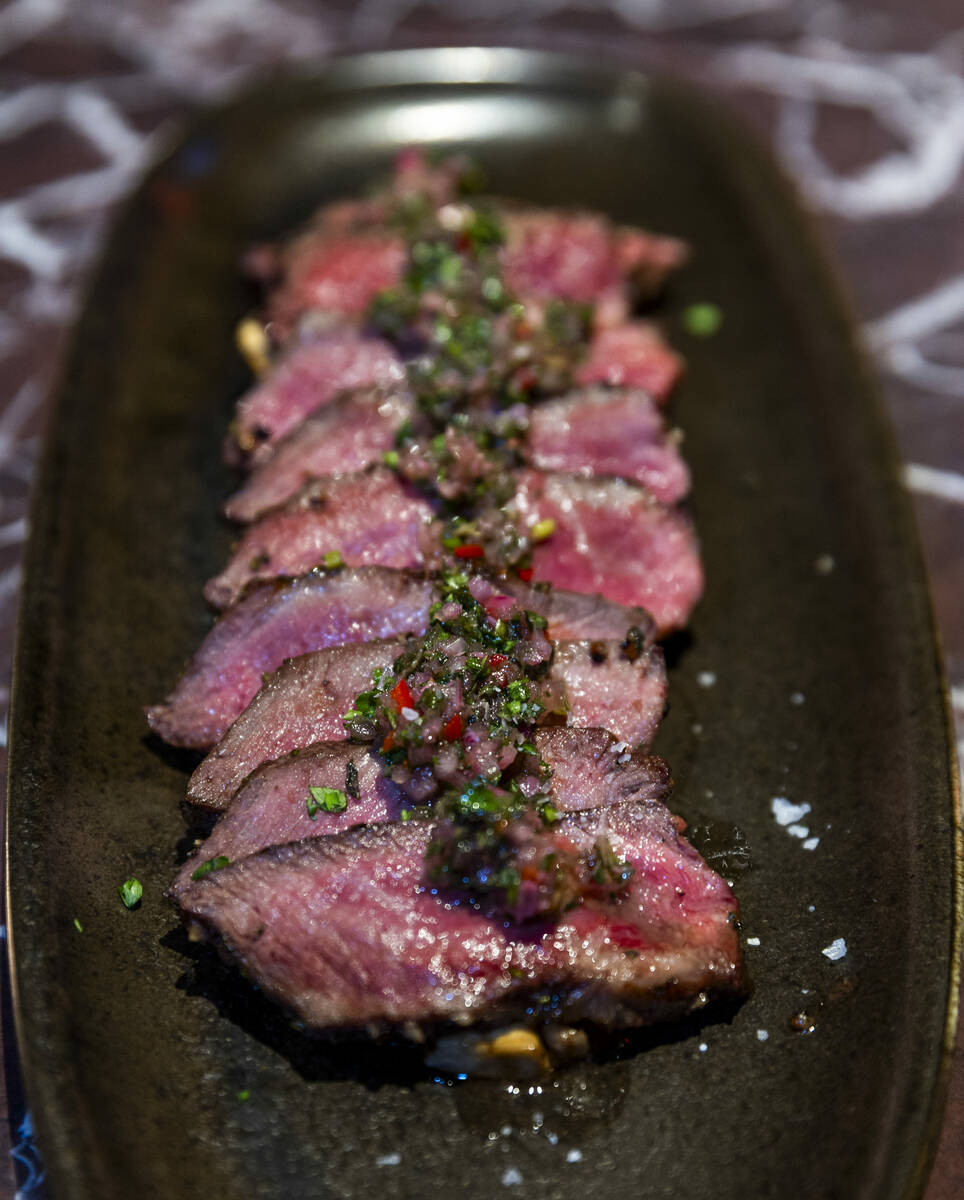 Himalayan Salt Dry-Aged Flat Iron Steak with grilled portobello and chimichurri available at th ...
