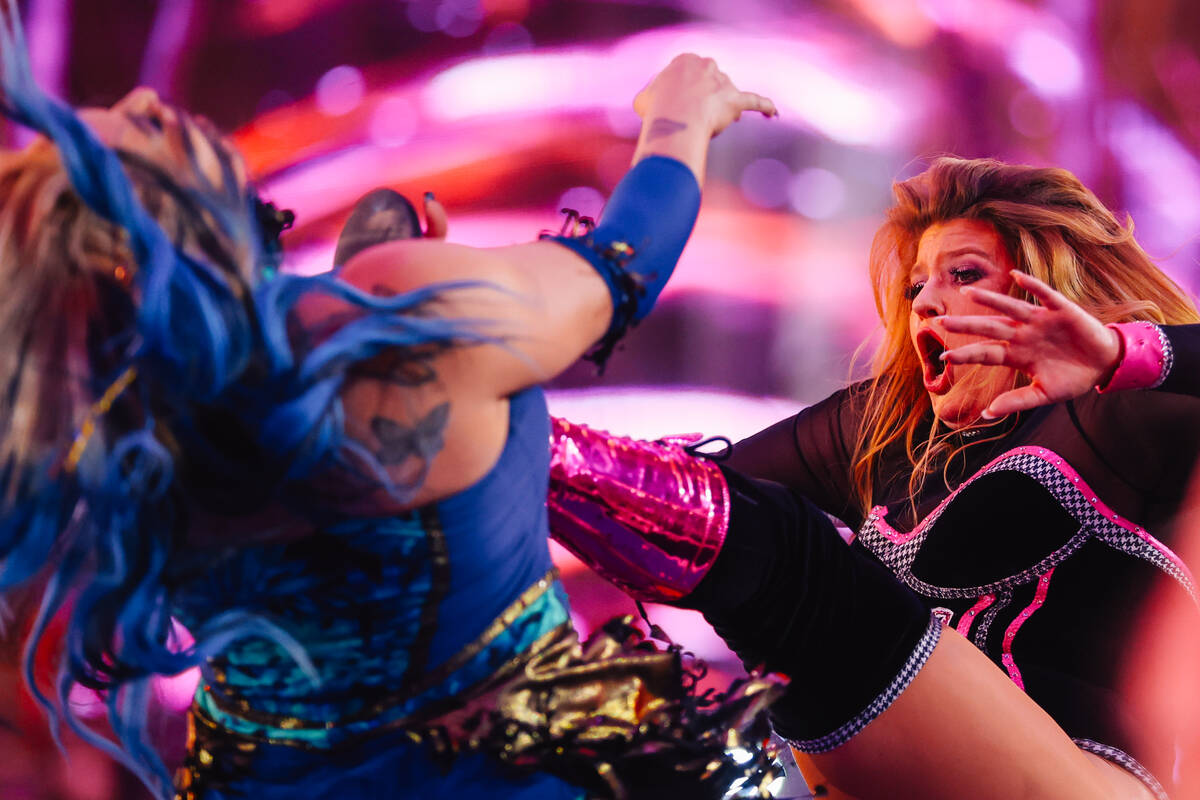 Penelope Pink, left, kicks Island Girl in a WOW Wrestling match on Fremont Street Wednesday, Oc ...