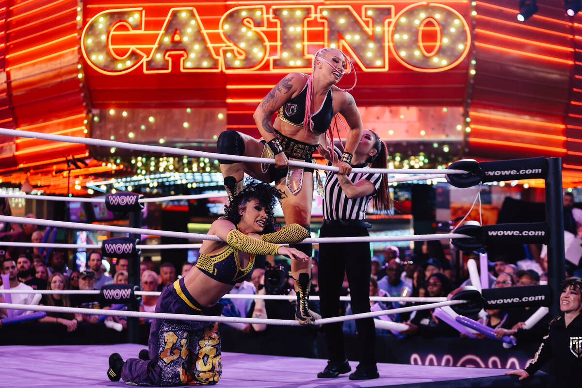 Kandi Krush, top, steps on Lil J-Boogie in a WOW Wrestling match on Fremont Street Wednesday, O ...
