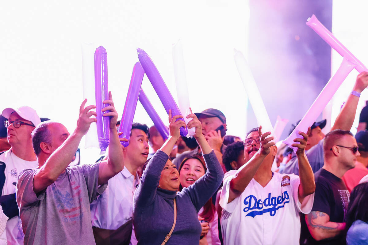Wrestling fans cheer during a WOW Wrestling match on Fremont Street Wednesday, Oct. 22, 2025, i ...