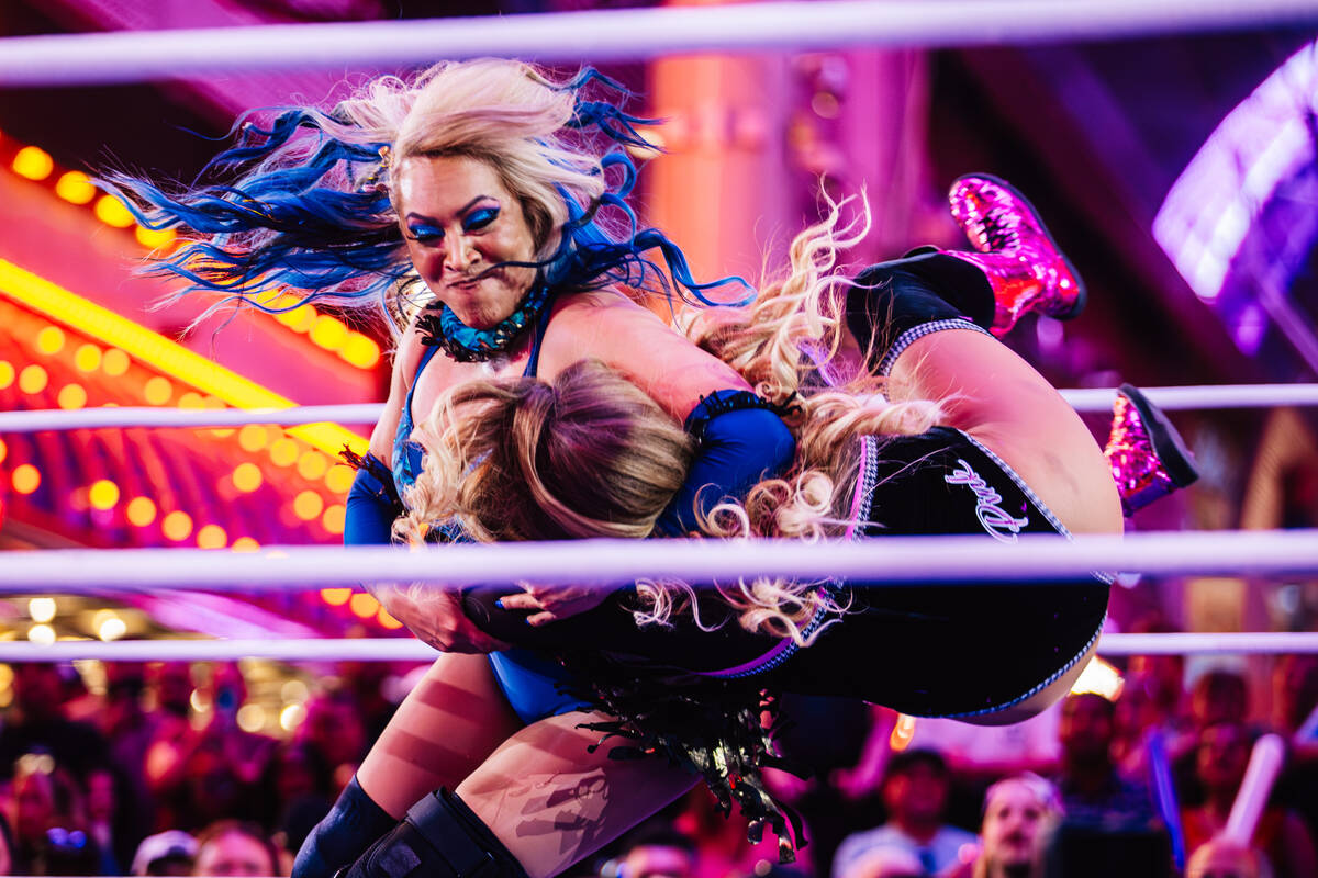 Island Girl, left, slams down Penelope Pink in a WOW Wrestling match on Fremont Street Wednesda ...