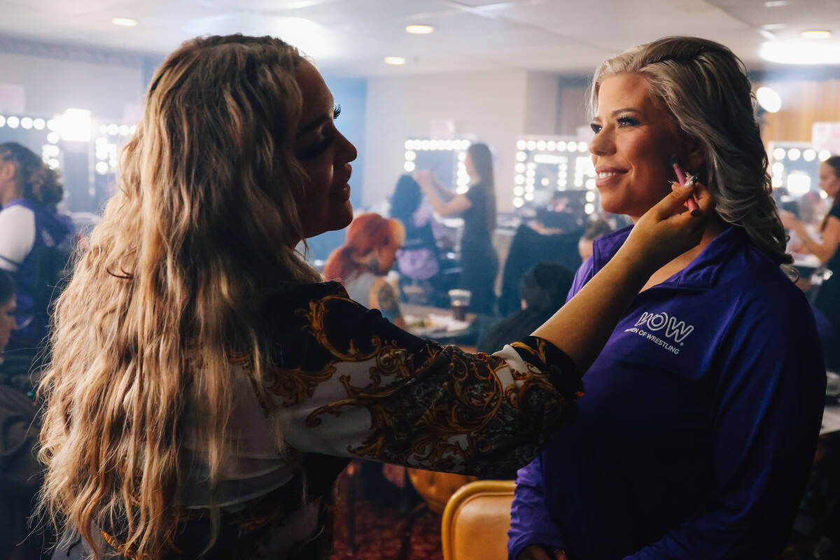 Versey Picone, left, does makeup for Abilene Maverick for the WOW Wrestling matches on Fremont ...