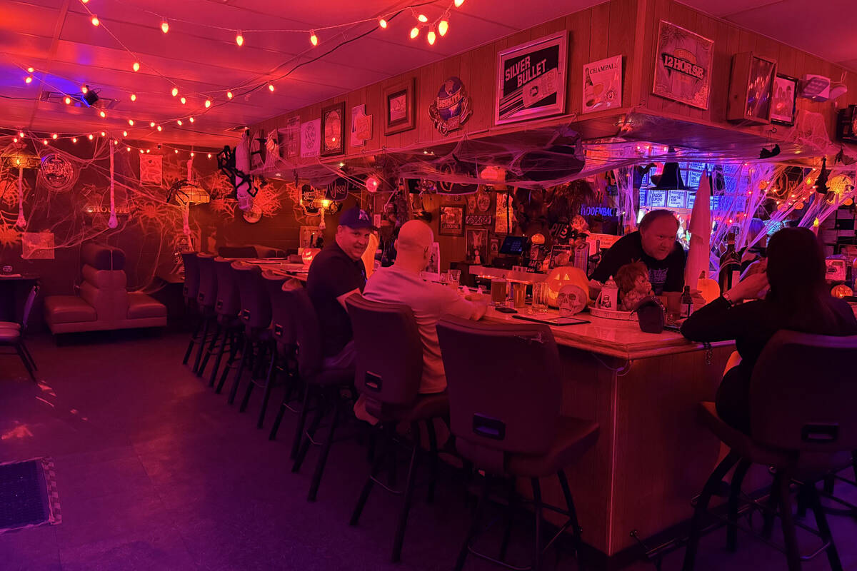 With red lighting and plenty of props, The Silver Stamp bar in downtown Las Vegas transforms ev ...
