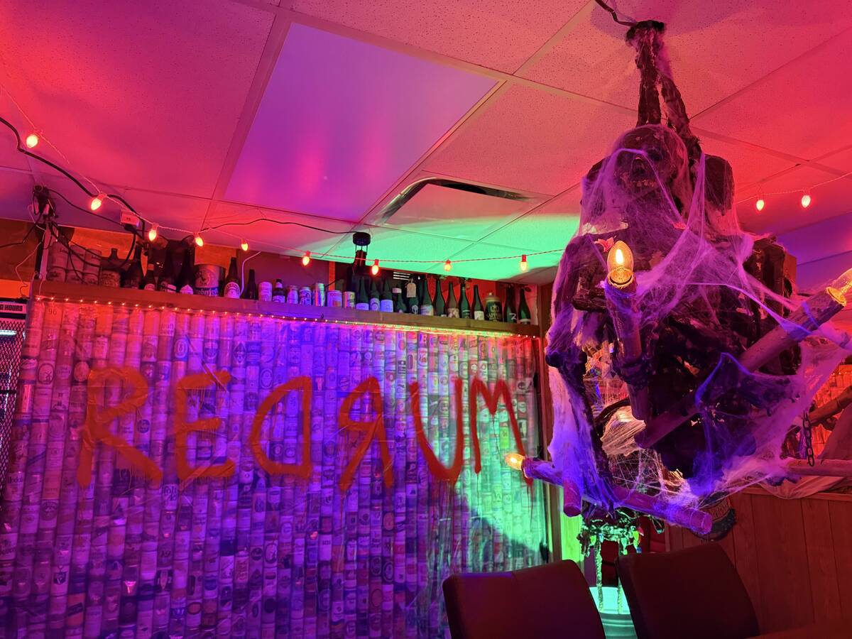 With red lighting and plenty of props, The Silver Stamp bar in downtown Las Vegas transforms ev ...