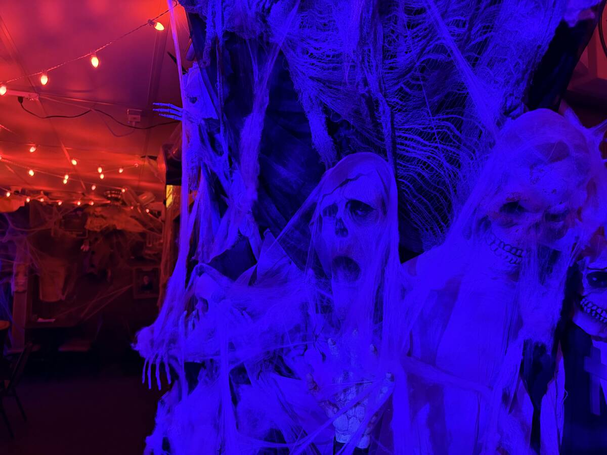With red lighting and plenty of props, The Silver Stamp bar in downtown Las Vegas transforms ev ...