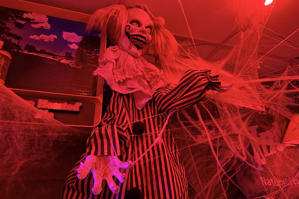 With red lighting and plenty of props, The Silver Stamp bar in downtown Las Vegas transforms ev ...