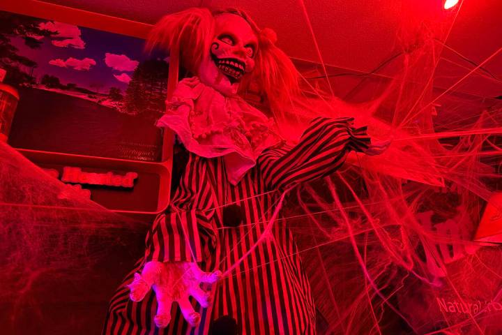 With red lighting and thousands of props, The Silver Stamp bar in downtown Las Vegas transforms ...