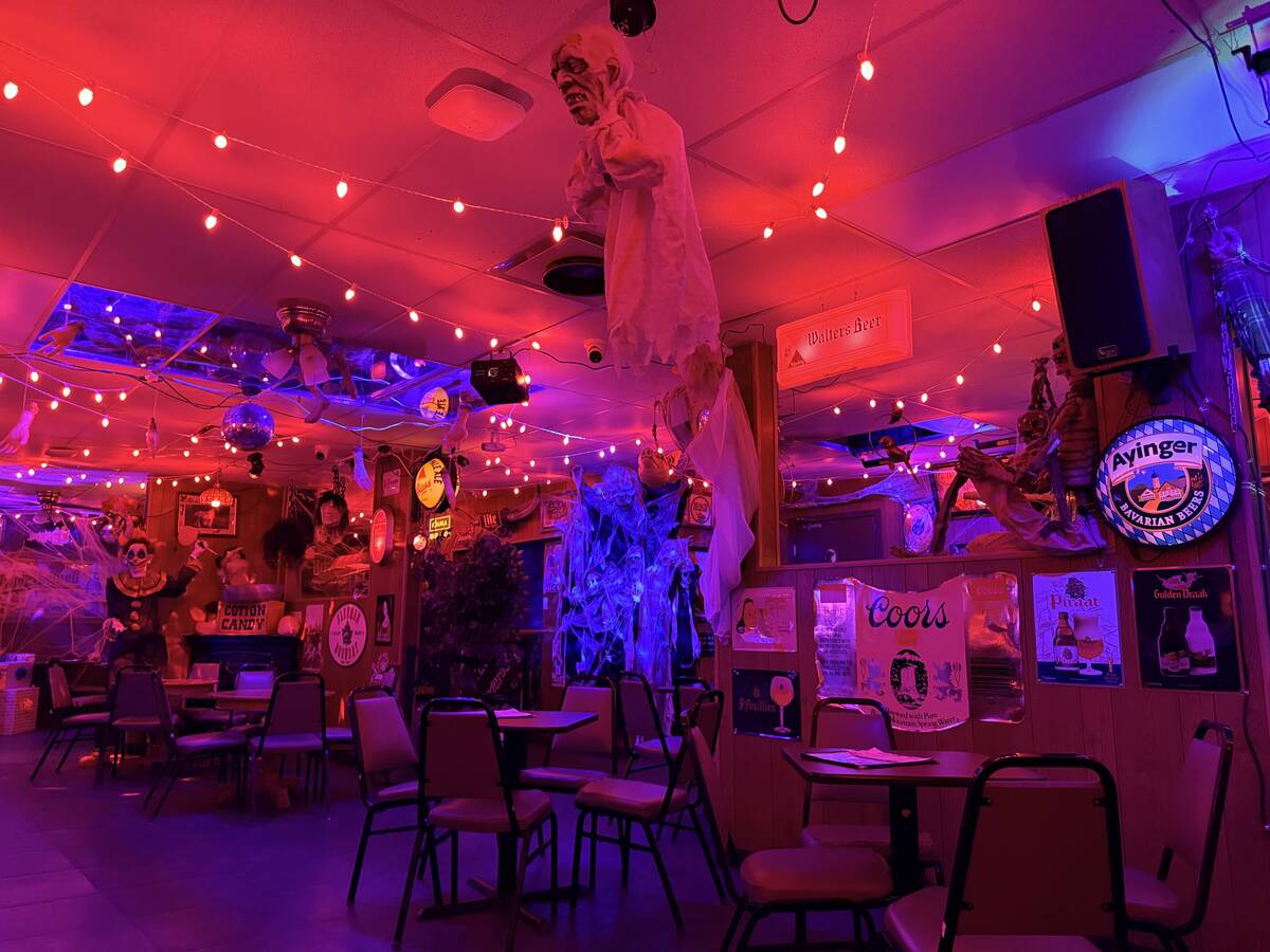 With red lighting and plenty of props, The Silver Stamp bar in downtown Las Vegas transforms ev ...