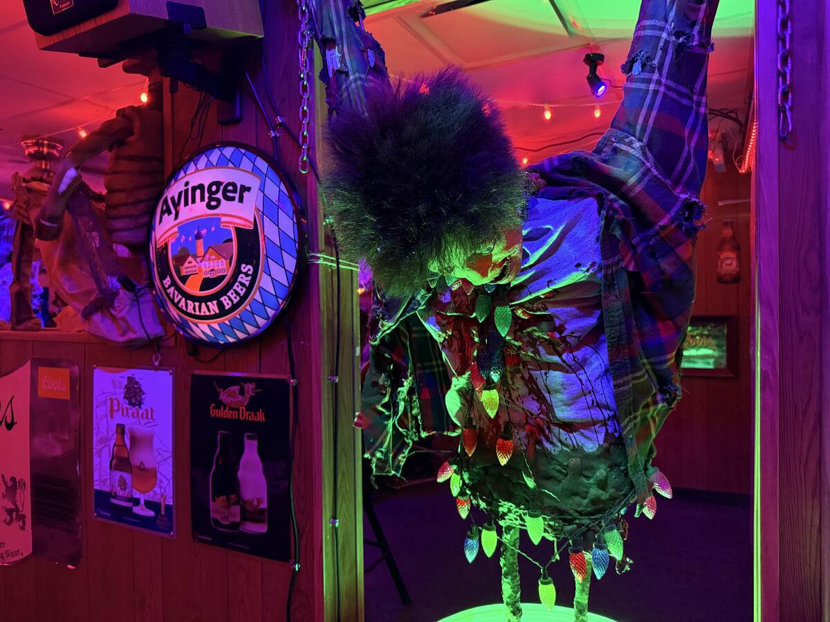 With red lighting and plenty of props, The Silver Stamp bar in downtown Las Vegas transforms ev ...